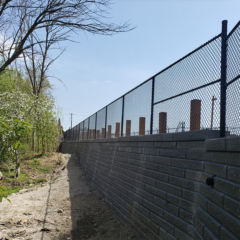 Commercial Chain Link Fence on top of Wall