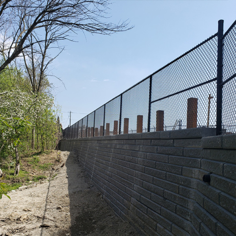 Commercial Chain Link Fence on top of Wall