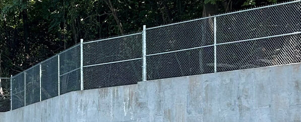Commercial Chain Link Fence on top of Wall