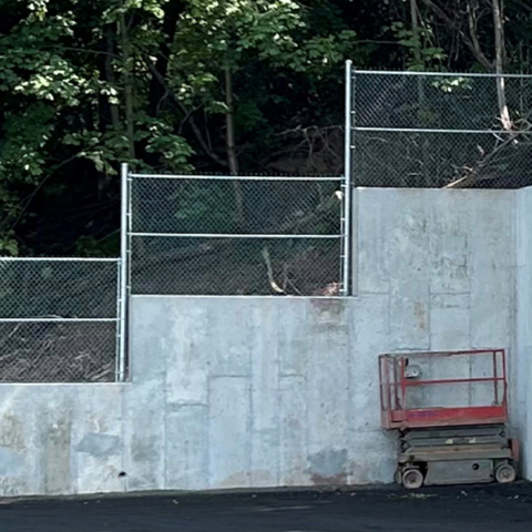 Commercial Chain Link Fence on top of Wall